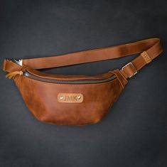 "This leather belt bag can become your new favourite accessory. It's made of high-quality leather and has a comfortable size so you can wear it on your waist or across your chest.There are several colour options. Do you know what can be stylish, trendy, and practical at the same time? Yes! You are absolutely right! It's all about a belt bag. You may like this type of bag or not but you will admit for sure that this bag is a perfect one for keeping your hands free and (keep all the things you nee Cheap Leather Belt Bag With Pockets, Luxury Leather Belt Bag For Women, Casual Leather Belt Bag, Panny Pack, Leather Hip Pouch, Leather Bum Bag, Leather Pouches, Leather Belt Pouch, Hip Pouch