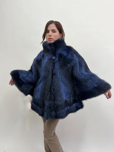 All garments are unique, handmade and under the copyright of BeFur. They all eligible to global policies of producing and commercing. DESCRIPTION AND DETAILS New with tags Real blue raccoon fur cape with collar, one size fabulous navy and black fur cape with pockets, warm supple and affordable luxury fur gift. One size. Sleeve length from neckline: 64cm // 25.2 inches Garment's Length: 71 cm // 27.9 inches *Model wears normally size-- Small. Black silky lining. two side pockets. Fur hooks/clips Faux Fur Winter Cape Coat, Winter Cape-shaped Faux Fur Coat, Winter Faux Fur Cape Coat, Luxury Cape With Faux Fur Trim, Cape With Collar, Fur Dress, Fur Cape, Affordable Luxury, Dhl Express