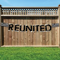 a wooden fence with the word reunited taped to it