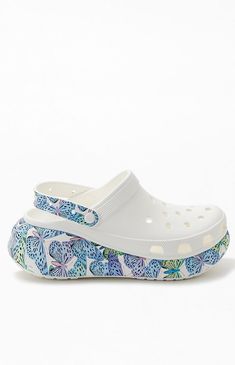 Your favorite pair of clogs from Crocs gets a major update this season in the Women's Classic Crush Butterfly Clogs. These comfy clogs have bold butterfly graphics at the heel strap and platform sole, ventilation holes, and lightweight construction.Platform soleButterfly graphics2" heightIconic Crocs ComfortLightweight constructionPivoting heel strapVentilation holes Crocs Womens Women's Classic Crush Butterfly Clogs - White size 8 Crocs Platforms, Shoe Artwork, Pretty Shoes, Sandals Summer, Strap Heels, Summer Shoes, Pacsun, New Shoes, Womens Shoes Sneakers