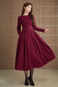 The attention to detail in the construction of this long burgundy wool dress is evident in every stitch, show casing the craftsmanship and expertise that went into its creation.  For anyone looking to stay stylish during the colder seasons.  DETAIL * 30% wool, 30% fiber, 40% polyester * Fully satiny lining, more nice to the touch body * Two side seam pockets * Back zipper closure * Long dress * A Line wool dress * Retro wool dress, Mod clothing * For autumn and winter * Lean More about the items From the FAQs on the page bottom More color in No.3: https://etsy.me/4fGTZ6f MODEL SIZE Bust 85 cm(33.4") Waist 67 cm(26.7") Height 168cm (5' 6") She wears size XS Choose CUSTOM Order if you * Need a better fit * Can't find your size in our size Chart * Change the Style * Chang the Length * Your He Wool Dress Winter, Long Wool Dress, Mod Clothing, Warm Dress, Midi Dress For Women, Custom Dress, Dress Winter, Dress Retro, Dress Making Patterns