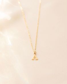 Letter necklace, Initial necklace, Gold initial necklace, Minimal initial necklace, Tiny initial necklace, Name necklace, Gold letter --- Stun in this personalized dainty gold filled mini Letter Necklace and you'll never want to take it off. Details: -Gold Filled, Sterling Silver -8mm Letter -Waterproof, Tarnish Resistant, Hypoallergenic -Length 18" Simple Tiny Initial Pendant Necklace, Simple Initial Pendant Necklace With Delicate Chain, Simple Yellow Gold Initial Pendant Necklace, Simple 14k Gold Initial Pendant Necklace, Simple Tiny Initial Pendant Charm Necklace, Simple Tiny Initial Pendant Charm Necklaces, Dainty Initial Pendant Name Necklace, Minimalist Initial Pendant Necklace With Delicate Chain, Minimalist Yellow Gold Initial Pendant Necklace