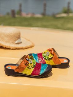 Usher in a pop of color with these statement-making slides fashioned with colorful stripe accents and luxurious leather.. 0.98'' heel Slip-on Genuine leather upper Leather lining Leather midsole Leather insole Rubber sole Multicolor Leather Clogs For Spring, Multicolor Round Toe Mules For Summer, Multicolor Open Toe Mules, Multicolor Slip-on Beach Mules, Multicolor Slip-on Mules For Beach, Multicolor Sandals With Leather Footbed For Summer, Multicolor Leather Footbed Sandals For Summer, Multicolor Leather Sandals For Summer, Multicolor Closed Toe Mules With Removable Insole