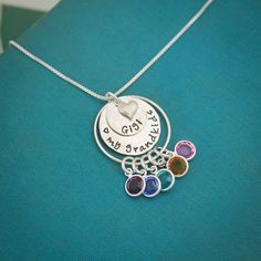 "Personalized Grandma Necklace, Grandmother Necklace, Birthstone Necklace, Love my Grandchildren Necklace, Hand Stamped, Mother's Day Gift This is a perfect Mother's Day Gift for Grandma to show off all of her children or grandchildren. A sterling silver pendant of stacked discs are hammered and hand stamped with her special grandmother name and then bottom disc can be stamped with a special message. A tiny sterling silver heart charm adorns the top of the disc. A sterling silver ring holds all Personalized Multicolor Pendant Jewelry, Sterling Silver Charm Name Necklace For Birthday, Birthday Jewelry Pendant With Hallmark, Hallmarked Pendant Jewelry For Birthdays, Birthday Pendant Jewelry With Hallmark, Birthday Hallmarked Pendant Jewelry, Nickel-free Multicolor Jewelry For Mother's Day, Adjustable Charm Necklace For Birthday, Adjustable Charms Necklace For Birthday