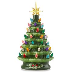 a green ceramic christmas tree with lights on it's base and a star above the top