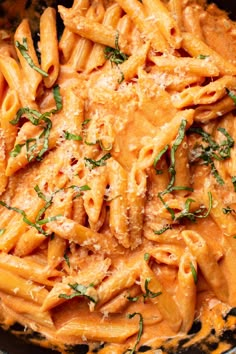 pasta with sauce and parmesan cheese in a skillet, ready to be eaten