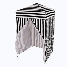 a black and white striped table cover with an open pocket on the top that has been folded over