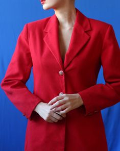 Vintage red simple hip length blazer jacket. Long sleeves, darted waist, padded shoulders, two side pockets, full lining. Classic yet exclusive designers cut. Material is polyester. Tag: C&A Size 36, IT 44, UK 10 Fits like size S. Measured laying flat: 28'' / 71 cm long 19'' / 48 cm armpit to armpit 17'' / 43 cm waist 16'' / 41 cm shoulders seam to seam 23'' / 59 cm sleeve length Great vintage condition. Tailored Red Career Blazer, Red Single-breasted Blazer For Business Casual, Tailored Red Blazer For Career, Red Single Breasted Blazer For Business Casual, Red Tailored Blazer For Career, Red Single-button Long Sleeve Blazer, Red Single Button Long Sleeve Blazer, Red Single Button Blazer With Long Sleeves, Red Fitted Blazer For Career