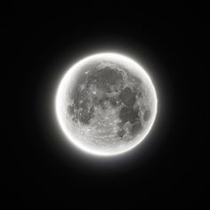 the full moon is seen in the dark sky