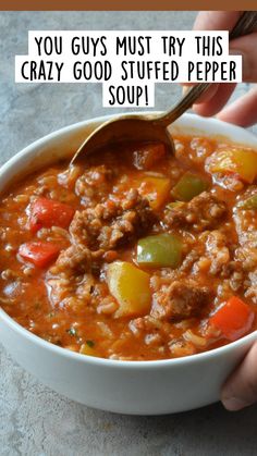 someone is holding a spoon over a bowl of soup with the words, you guys must try this crazy good stuffed pepper soup