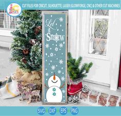 a snowman sign sitting in front of a house with christmas decorations on the porch