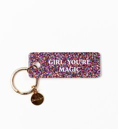 a keychain that says girl you're magic with sprinkles on it