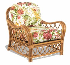 a chair that is made out of wood and has flowers on the seat padding