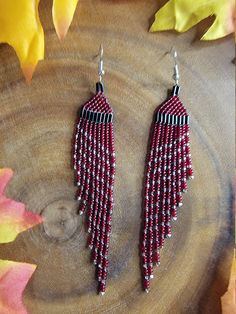 "I love these 4.5\" long dazzling, elegant, handmade beaded, Dark Garnet, Silver and Black, wing shaped, fringed earrings for pierced ears made by me \"Be Dazzled Earrings\" Designs By Ruby. They shimmer and sparkle in the light with the colors giving them an elegant, regal look.  I made these beautiful earrings using size 11 quality glass beads and nickel free silver-plated brass ear wires for those with metal sensitivity. Every bead is hand stitched by me and all sizes are approximate due to v Fringed Earrings, Dark Garnet, Bead Sizes, Stunning Earrings, Fringe Earrings, Pierced Earrings, Pierced Ears, Designer Earrings, Earings Piercings