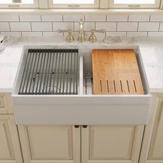 the kitchen sink is clean and ready to be used as a dishwasher or drainer