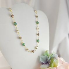 "This handcrafted green aventurine beaded necklace is a unique piece that makes a memorable green gemstone jewelry gift for her. It is sold as a 3-piece set of 3-inch long earrings, an adjustable 18-20 inch necklace and a matching 6.5-8 inch bracelet. The earrings are made with 14K gold-filled 20-gauge French earwires, and the necklace and bracelet are made with our anti-tarnish treated gold wire, chain and lobster clasps.  The beads used in this elaborate design are 8mm and 12mm vintage cloisonne beads, genuine 8x13mm green aventurine oval beads and 8mm white shell pearls. Thank you for visiting Gemsicles!  - Shop Gemsicles, an Etsy boutique with hundreds of sparkly items for weddings, gifts and just because. Our original jewelry designs feature gemstones, Discontinued Designer crystals, Amazonite Gemstone Necklaces For Jewelry Making, Elegant Amazonite Bead Necklaces, Elegant Beaded Jade Crystal Necklaces, Elegant Beaded Jade Crystal Necklace, Elegant Amazonite Beaded Necklace, Green Jade Beaded Chain Jewelry, Handmade Amazonite Round Beads Necklaces, Green Jade Jewelry With Beaded Chain, Elegant Amazonite Round Beads Jewelry