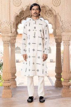 White full sleeves kurta crafted in cotton mulmul with contrasting black thread and geometric fleur mirror embroidery. Paired with a pant. - Aza Fashions White Cotton Kurta With Geometric Embroidery, Cotton Straight Kurta With Geometric Embroidery, Cotton Kurta With Geometric Embroidery For Eid, Long Sleeve Cotton Traditional Wear With Mirror Work, Cotton Kurta With Geometric Embroidery And Long Sleeves, Long Sleeve Cotton Kurta With Geometric Embroidery, Traditional Long Sleeve Kurta With Geometric Embroidery, Long Sleeve Kurta With Geometric Embroidery, Kurta Set Men