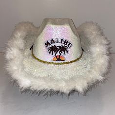 a white hat with a palm tree and the word maliuo on it's side