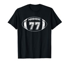 a black t - shirt with the number seventy on it and an american football ball