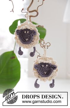 a crocheted sheep hanging from a hook