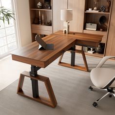 an office with a desk, chair and bookcase in the corner on carpeted flooring