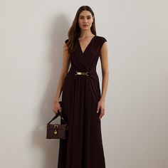 Realized in smooth jersey the column silhouette of this surplice gown is detailed with bodice and skirt pleats that gather into an “LRL”-engraved metal buckle at the front of the waist. Engraved Metal, Metal Engraving, Ralph Lauren Purple Label, Pinot Noir, Wimbledon, Formal Wear, Lauren Ralph Lauren, Ankle Length, Pleated Skirt