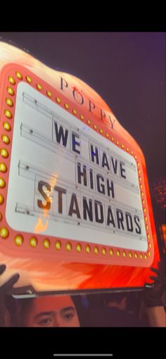 a sign that says we have high standards