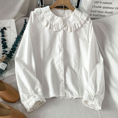 Long sleeve blouse with a frilly peter pan collar with floral eyelet trims and cuffs. S: 13.5" across shoulders, 36" chest, 22" length M: 14" across shoulders, 37.5" chest, 22.5" length L: 14.5" across shoulders, 39" chest, 23" length XL: 15" across shoulders, 40.5" chest, 23.5" length Collar Blouse Outfit, Thrifting Manifestation, Frilly Shirt, Victorian Shirt, Tale Dress, White Collared Blouse, Frilly Top, Peter Pan Collar Shirt, Peter Pan Collar Blouse