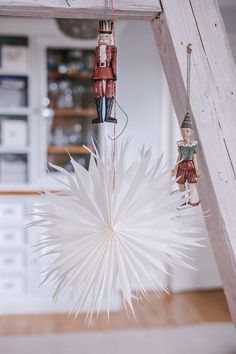 an ornament hanging from a wooden ladder