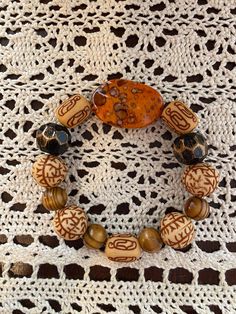 Fall Color Bracelet Set.  Orange, Brown and Black Bracelet Set.   Perfect for Fall. Brown Bracelets With Large Beads For Festival, Handmade Bohemian Brown Wristband, Bohemian Handmade Brown Wristband, Handmade Brown Bracelets For Crafting, Brown Bracelet Wristlet, Bohemian Brown Wristlet For Gift, Handmade Vintage Bracelets For Beach, Unique Handmade Brown Bracelets, Unique Brown Bracelet For Beach