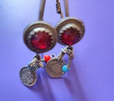 Beautiful antique pre-owned berber silver earrings , with red beads! this pair of earrings is worn by berber woman  in south of Morocco in souss region anti atlas mountain especially in wedding ceremonies and in traditional Folklore Dance !  dimension: Circle diameter is 5 cm long appr 1.96" best luck Red Beads, Wedding Ceremonies, Berber Women, Red Bead, Morocco, Favorite Jewelry, Vintage Antiques, Silver Earrings, Glass Beads