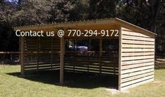 a wooden shelter with the words contact us at 70 - 949 - 9172