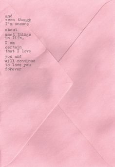 an open pink envelope with the words i love you written on it