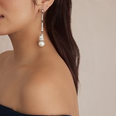 The Audrey earrings are perfect for minimalist brides on their big day. Featuring genuine crystal stones cascading into a dreamy Czech glass pearl drop, these earrings are the perfect mix of contemporary style and classic elegance. These earrings feature a standard post back. All jewelry is made to order in our New York City design studio. Please allow 7-14 business days for production from the order date. Measurements: 0.25"W x 4"L Minimalist Bride, Classic Earrings, Crystal Stones, City Design, Pearl Drop, Classic Elegance, Czech Glass, Stones And Crystals, Big Day