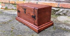 an old wooden chest sitting on the ground