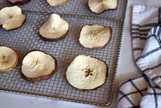 some apples are sitting on a cooling rack