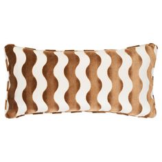 a brown and white pillow with wavy lines on the front, sitting on a white background