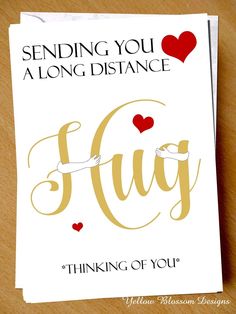 a greeting card with the words sending you a long distance hug and hearts on it