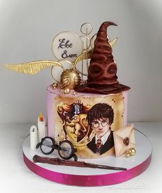 a harry potter themed birthday cake with accessories