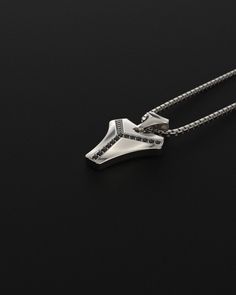 This magnificent pendant is composed of 18k white gold, includes 16 black diamonds and is completely handmade. A talisman stone is for those who want to know what life is all about. It will bring out all of your great qualities. The vertebrae that make up the human spine influenced its design. On a psychological level, this diamond represents what gives man the fortitude, bravery, drive, and unwavering belief to achieve his goals.Many people like white gold because of its silvery white hue, which gives it a refined appearance while also making it considerably more expensive than silver.White gold is impervious to rust, tarnish, and corrosion. White gold is more durable than yellow gold because it is alloyed with a combination of harder metals. Made entirely by hand with all the love and ar Luxury Black Diamond Pendant Necklace, Sterling Silver Black Diamond Pendant Necklace, Sterling Silver Pendant Necklace With Black Diamonds, Modern Sterling Silver Jewelry With Black Diamonds, Minimalist Silver Jewelry With Black Diamonds, Luxury Black Spinel Silver Jewelry, Black Diamond Pendant, Human Spine, Hard Metal