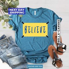 "Believe Shirt, Motivational Sport T-shirt, Ted Shirt, Team Tee, Believe T-shirt, Lasso Believe Shirt, Lasso Gift Hi! Welcome NeoTeeApparel. It's great to see you here! ☺️  Our shirts are clean, high quality and soft. It is prepared quickly by our boutique.  Ironing and shipped.  Enjoy your shopping!  It is a pleasure for us to help you with your questions and you can reach us at any time.  Please, don't forget to check our size cards. HOW TO ORDER SHIRT 👕  Please, choose your favorite t-shirt Comfortable Blue T-shirt With Graphic Print, Basic Blue T-shirt With Slogan, Blue T-shirt With Slogan In Relaxed Fit, Blue Slogan Shirt With Crew Neck, Blue Tops With Letter Print And Comfortable Fit, Comfortable Blue Letter Print Top, Blue Crew Neck Shirt With Slogan, Blue Letter Print Top With Comfortable Fit, Blue T-shirt With Graphic Print, Comfortable Fit