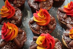 chocolate cupcakes with orange and red frosting