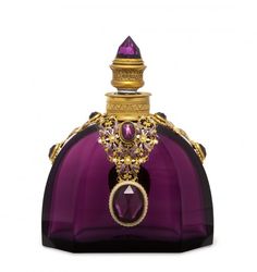 a purple bottle with gold trimmings and a ring on it's top