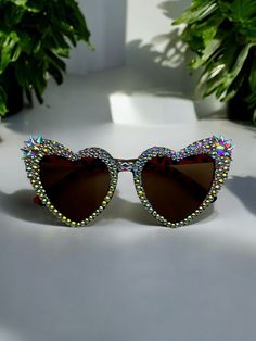 These sunglasses are the perfect accessory to TURN UP with! They are statement pieces that will earn you nonstop COMPLIMENTS!! Heart-shaped Sunglasses With Tinted Lenses As Gift, Heart Sunglasses With Beads, Rhinestone Heart Sunglasses, Multicolor Heart-shaped Sunglasses With Gradient Lenses, Heart-shaped Multicolor Sunglasses With Gradient Lenses, Heart-shaped Tinted Glass Sunglasses, Fun Heart-shaped Sunglasses With Heart Print, Heart-shaped Glass Sunglasses With Tinted Lenses, Heart-shaped Sunglasses With Tinted Glass Lenses