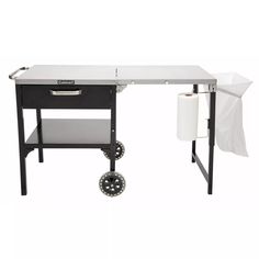 a black and white desk with wheels on it