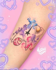 a tattoo on the leg of a woman with an airplane in space and stars around it