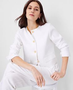 Elevate your wardrobe with the Ann Taylor Cropped Crew Neck Jacket, a piece that marries sophistication with comfort. This jacket is perfect for transitioning from spring to summer, thanks to its breathable herringbone linen blend.

- **Size**: 14
- **Color**: White
- **Material**: 54% Linen, 29% Polyester, 15% Viscose, 2% Spandex; Lining: 100% Polyester
- **Gender**: Female
- **Fit**: Hits at waist
- **Length**: 18 inches long
- **Features**: Crew neck, long sleeves with button-open option for Chic Career Blazer For Spring, Chic Spring Career Blazer, Spring Career Blazer With Hidden Button Closure, Chic Summer Outerwear With Button Cuffs, Elegant Linen Button-up Outerwear, Spring Tailored Career Blazer, Classic Spring Blazer With Button Cuffs, Business Casual White Outerwear With Button Cuffs, White Linen Button-up Blazer