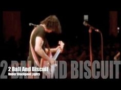 two men standing in front of microphones with the words 2 ball and biscuit written on them