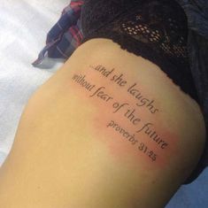 a woman's leg with a tattoo that reads, and the laughs behind her