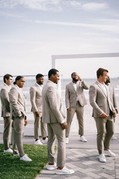 a group of men in suits standing next to each other